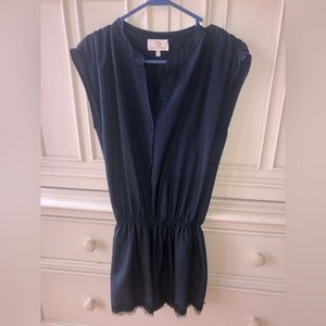 Women’s Navy Blue Romper with Black Lace Detail on shorts.